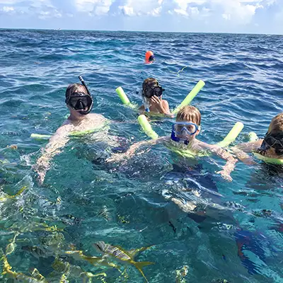 Family snorkeling together at Looe Key Reef